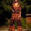 Macacão estampado Outono, com riscas laranja, vermelho e castanho, da Manuela Moreira, à venda na Charme Store, Ovar